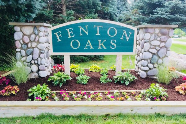 Subdivision entrance with mulched flower bed